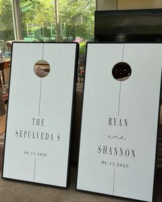 two signs are sitting on the floor in front of a window that says, the sewedds and shannon