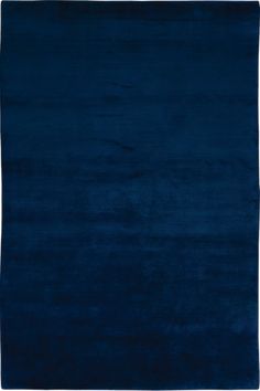 a dark blue rug with white border