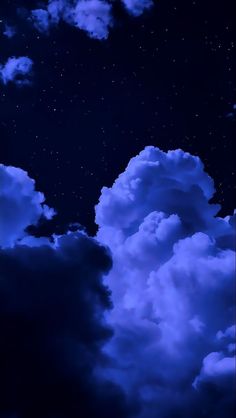 the night sky is full of clouds and stars