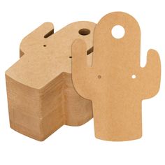 two wooden blocks with holes in the middle and a cactus shaped object on each side