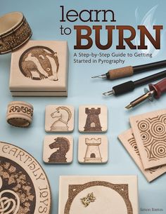 the cover of learn to burn book with stamps and ink pens on top of it