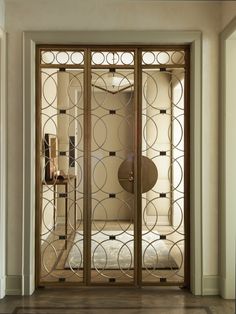 an ornately designed glass door in a hallway