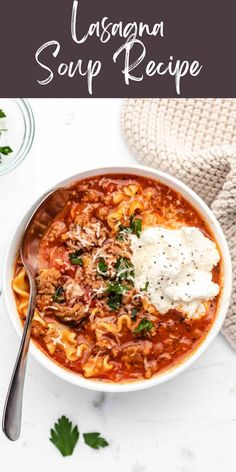 a white bowl filled with pasta soup and topped with parmesan cheese on top