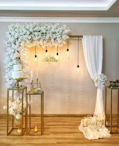 a white and gold wedding setup with flowers