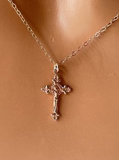 This is a 14K rose gold filled crucifix cross charm necklace.  This is a beautiful ornate crucifix cross in 18kt rose gold filled, measures 20x12mm and comes on a 14kt rose gold filled shiny cable chain with spring clasp.  Choose length of 16", 18", 20" or 22".  Comes in a cute gift box ready to present.  STERLING SILVER VERSION NOT SHOWN. *Model is wearing a 16" length in the photo. GOLD IN PHOTO IS OUT OF STOCK AND WILL NOT BE RETOCKED. ONLY ROSE GOLD AND STERLING SILVER LEFT. Luxury Formal Crucifix Cross Necklace, Luxury Elegant Crucifix Cross Necklace, Luxury Rose Gold Cross Jewelry, Spiritual Rose Gold Cross Necklace, Rose Gold Crucifix Necklace As Gift, Dainty Rose Gold Crucifix Jewelry, Gift Rose Gold Crucifix Cross Necklace, Dainty Rose Gold Crucifix Necklace, Rose Gold Cross Necklace As A Gift