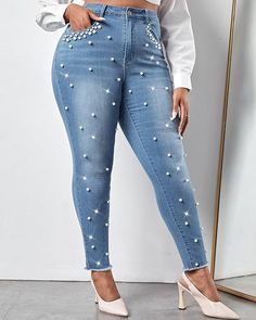 About this item: 
Classic Mid Rise women's skinny jeans with a flattering waistline made from premium stretchy denim fabric for a comfortable fit.
Featuring pearl and rhinestone embellishments for a touch of glamour and uniqueness to the outfit.
Versatile and trendy skinny jeans that can be paired with various tops and shoes for casual or dressy looks.
The timeless design and embellishments make them a versatile wardrobe staple suitable for different occasions.
Made to provide a flexible fit, these jeans are a combination of comfort and style for all-day wear. Pearl Jeans, Plus Size Jeans, Light Wash Denim, Plus Size Casual, Primavera Estate, Summer Fall