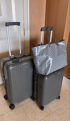 two pieces of luggage sitting next to each other