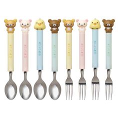 six spoons with teddy bears on them are lined up