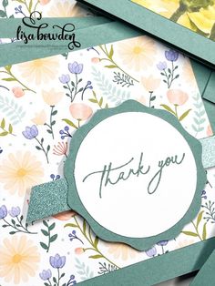 a thank card with flowers on it and the words thank you written in cursive writing