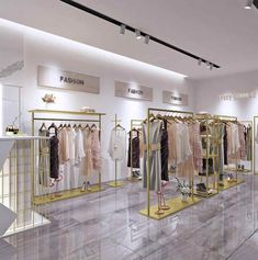 the inside of a clothing store with mannequins and dresses on display in gold racks