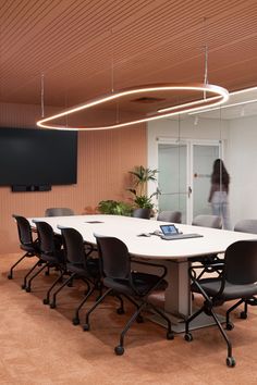 an office meeting room with a long table and chairs