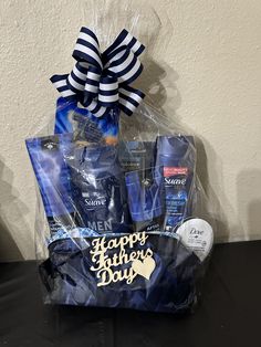 a blue gift basket filled with men's grooms products