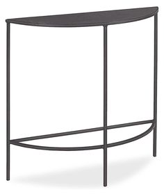 the curved metal console table is black