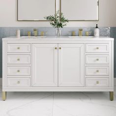 two mirrors are above the double sink vanity in this bathroom with marble flooring and white cabinetry