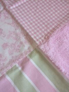 pink and green checkered sheets are laying on top of each other in the same pattern