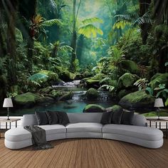 a couch sitting in front of a wall mural