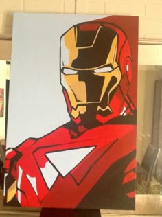 a painting of iron man is displayed on a easel