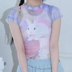 Harajuku Kawaii Aesthetic Pastel Y2K Bunny Print Mesh Tshirt Measurements S Bust: 74cm/29.1" Length: 44cm/17.3" M Bust: 78cm/30.7" Length: 45cm/17.7" L Bust: 82cm/32.2" Length: 46cm/18.1" *This product is see-through. We recommend layering another top underneath. *Standard shipping time to the US is 9-19 business days. Please consult our shipping page for shipping time estimates for other countries. *Please check the measurements/size chart very carefully when ordering from The Kawaii Factory. M Spring Anime Print Short Sleeve T-shirt, Y2k Printed Streetwear Tops, Y2k Printed Tops For Streetwear, Y2k Printed Crew Neck T-shirt, Cute Fitted Printed Top, Kawaii T-shirt For Spring Streetwear, Kawaii Anime Print T-shirt For Summer, Y2k Anime Print Short Sleeve Top, Y2k Anime Print Summer T-shirt