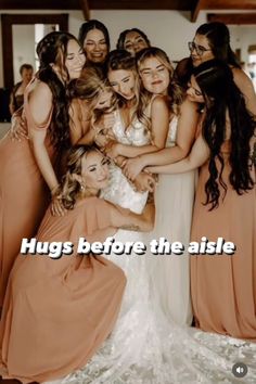 a group of women standing next to each other with the caption hugs before the aisle