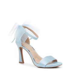 a women's blue high heeled sandal with a bow on the ankle