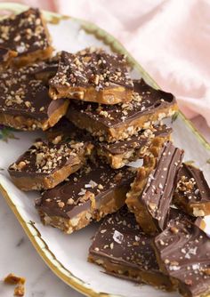 a plate filled with chocolate and nuts on top of a table