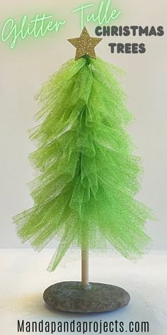 a green christmas tree made out of tulle and gold glitter star on top, with text overlay that reads glitter - tale christmas trees