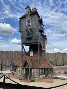 the house is made out of wood and has two stories on each level with windows