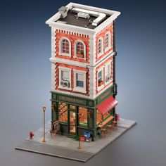 a small model of a building with an awning on the front and side of it