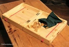 a wooden box with some wood pieces in it