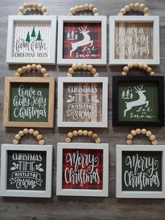 six framed christmas cards hanging on a wall with wooden bead necklaces around them