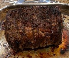 a piece of meat sitting on top of a metal pan