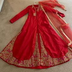 This Dress Is A 2 Piece Set And Comes With Dress And Dupatta. There Is A Center Split And The Back Is Fully Lined. Bust Is A 36 Inches Festive A-line Wedding Gown, Festive A-line Wedding Dress, Anarkali Evening Dress With Traditional Drape, Anarkali Dress With Traditional Drape For Evening, Evening Anarkali Dress With Traditional Drape, Red Silk Anarkali Set With Long Sleeves, Long Sleeve Silk Dresses For Occasions, Anarkali Long Sleeve Gown, Silk Evening Dress With Dupatta