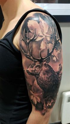 a woman with a deer tattoo on her arm