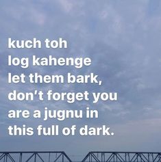 a bridge with the words kuch toh log kahenge let them bark, don't forget you are a jugnu in this full of dark