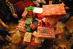 people sitting around with presents on the floor