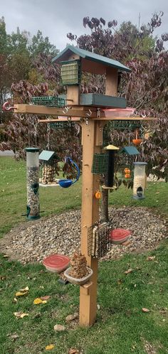 a bird feeder in the shape of a tree