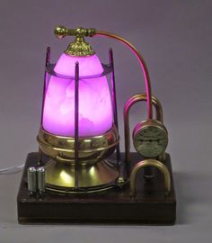 a purple light sitting on top of a wooden stand