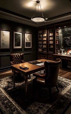 a room with a desk, chair and bookcases in the middle of it