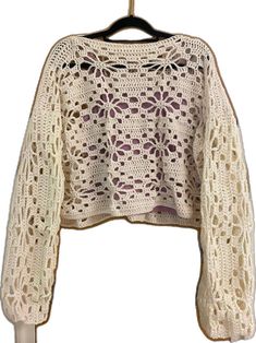 Beige Cotton Crochet Top For Fall, Beige Crochet Cotton Sweater, Bohemian Beige Crew Neck Crochet Top, Knit Crochet Lace Top With Crew Neck, Cream Crochet Cotton Sweater, Cream Cotton Crochet Sweater, Beige Long Sleeve Crochet Cotton Top, Cream Cotton Crochet Top For Fall, Winter Crochet Cream Tops