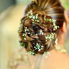 A huge bun glammed with multiple baby breaths. #bridalhairstyling #bridalhairaccessories #bridalhairstyle #bridehair #bridalhairandmakeup #bridalhairstyles #bridalhairdo #bridalhair #shaadisaga #bride #bridalinspo #bridalinspiration Hair Up With Flowers, Bridal Bun Hairstyles, Best Bridal Hairstyles, Flowers Indian, Floral Wedding Hair, Bridal Bun, Hair Up Or Down