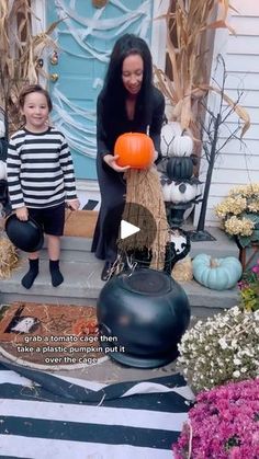 a woman and child are sitting on the porch with pumpkins in front of them