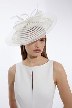 Get Dressed Up And Finish The Look With A Fascinator, With A Structured, Spiral Style Design And Bow Detailing, Fitted Onto A Comfortable, Round Base. Styles Perfectly With A Dress Or Pantsuit In Matching Tones For A Look Ideal For Wedding Guest Days And Days At The Racecourse. Spiral Bow Detail Fascinator Unique Spiral Design Three Dimensional Bow Design Statement, Large Size Circular Base Statement, Large Size Fitted White Fascinator For Ceremony, Elegant Spring Ceremony Fascinator, White Fitted Fascinator For Ceremony, Elegant White Fascinator For Ceremony, White Summer Ceremony Fascinator, White Elegant Fascinator For Ceremony, Elegant Fitted Fascinator For Wedding, Elegant Summer Fascinator For Ceremony, Elegant Summer Ceremony Fascinator