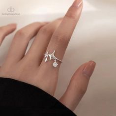 Indulge in celestial charm with our Shiny Star Cross Irregular Crystal Rings for Women. Each piece is a masterpiece of contemporary elegance, featuring a unique star-cross design adorned with dazzling crystals. The irregular shape adds an avant-garde touch, making it a perfect accessory for fashion-forward individuals. Crafted with precision and attention to detail, these rings are not just jewelry; they're a statement. The sparkling crystals catch the light, creating a mesmerizing effect that complements any outfit. The adjustable design ensures a comfortable fit, making it suitable for various occasions, from casual outings to special events. Elevate your style and express your individuality with this timeless piece. Whether you're treating yourself or searching for the perfect gift, our Luxury Rings, Star Decorations, Star Jewelry, Charm Rings, Shining Star, Star Ring, Color Ring, Sterling Silver Bands, Crystal Rings