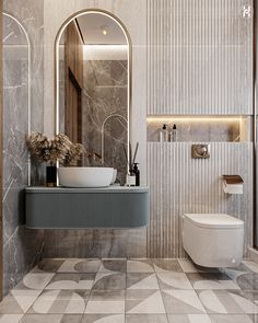 a bathroom with a sink, toilet and mirror on the wall next to a tiled floor