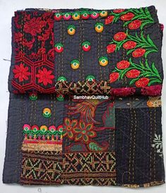 two pieces of cloth with different designs on them, one is black and the other is red