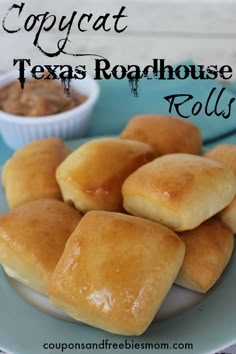 several rolls sitting on a plate with dipping sauce in the bowl next to it and text overlay that reads copycat texas roadhouse rolls