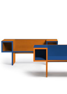 an orange, blue and black table sitting next to each other