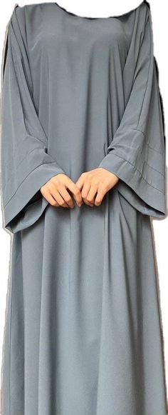 Modest Long Solid Color Kaftan, Long Abaya With Modesty Panel For Eid, Modest Dabka Abaya For Eid, Long Modest Abaya With Dabka, Modest Abaya With Modesty Panel For Eid, Modest Dabka Kaftan In Maxi Length, Modest Long Abaya For Eid, Modest Long Sleeve Khimar With Dabka, Solid Color Abaya With Modesty Panel For Eid