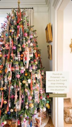 a christmas tree decorated with ornaments and ribbons