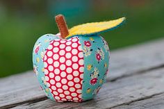 an apple sitting on top of a wooden table